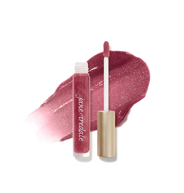 Tube of Jane Iredale HydroPure Hyaluronic Acid Lip Gloss with doe foot applicator cap removed and sample enlarged product application behind in shade Cosmo