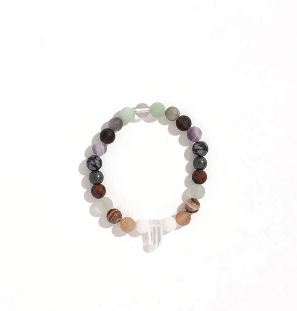Bracelet with round stone beads accented by a central clear crystal quartz point