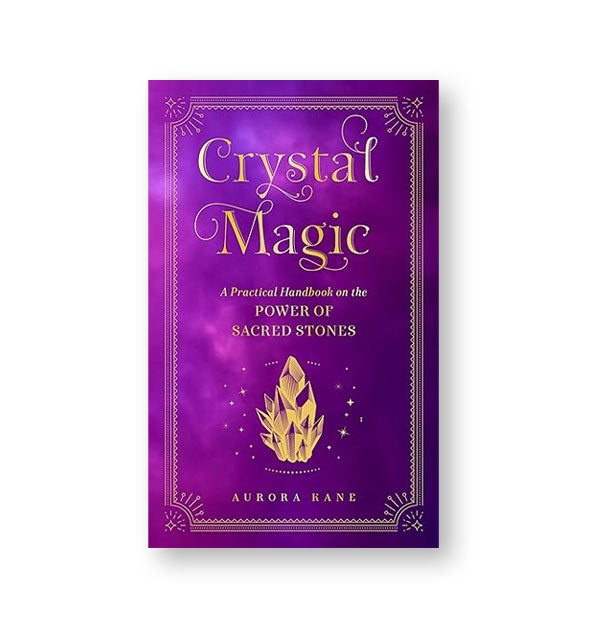 Purple cover of Crystal Magic: A Practical Handbook on the Power of Sacred Stones by Aurora Kane