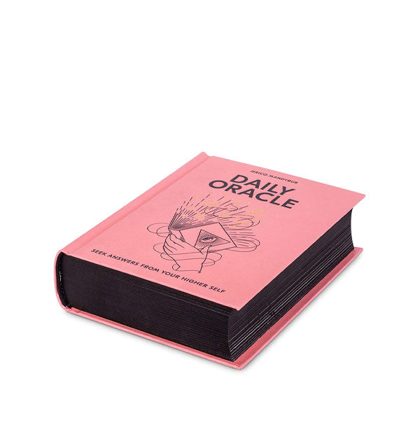 Three-quarter view of pink Daily Oracle with black page edges shown