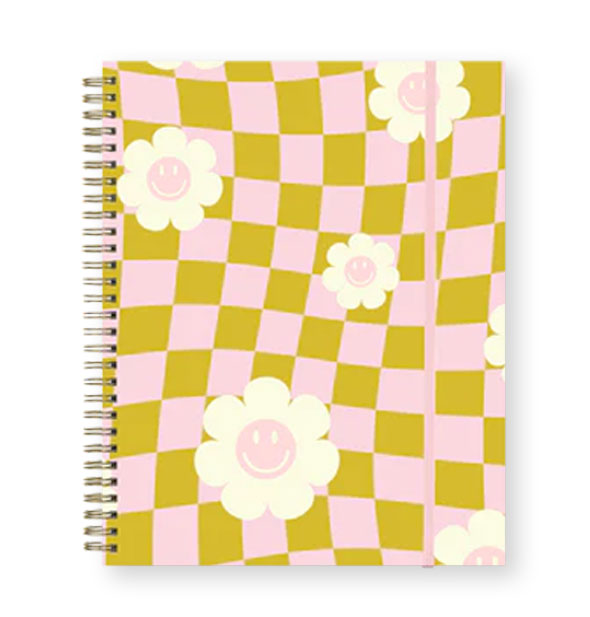 Spiral-bound journal with olive green and pastel pink wavy checker print accented by smiley face daisies and held closed with a pink elastic band