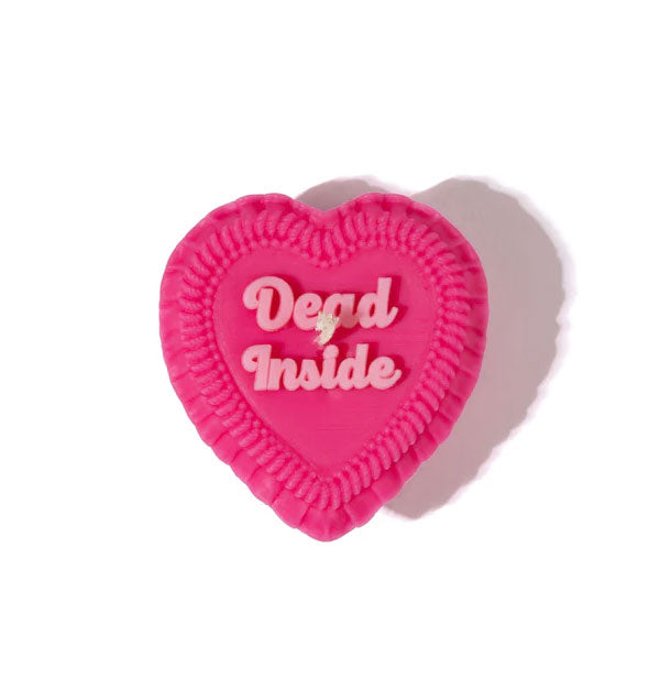 Dark pink heart-shaped candle designed to resemble a decoratively frosted cake that says, "Dead Inside" in light pink lettering on top