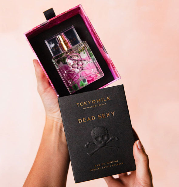 Model slides TokyoMilk Dead Sexy Eau de Parfum box open to reveal embossed glass bottle inside