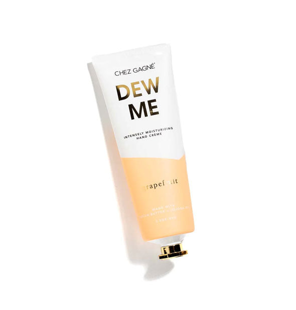 White and orange 5 ounce tube of Grapefruit Chez Gagné Dew Me Intensely Moisturizing Hand Creme with gold cap and lettering