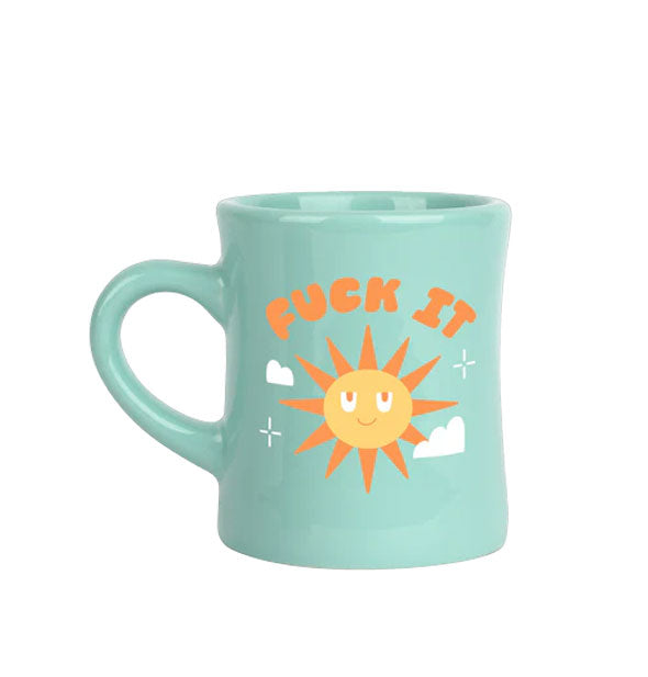 Aqua diner-style coffee mug says, "Fuck it" in orange lettering above a smiling sun graphic flanked by white clouds and stars