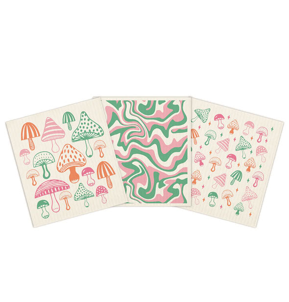 Mushroom print and psychedelic swirl print dish towel trio in a pink, orange, and green color way