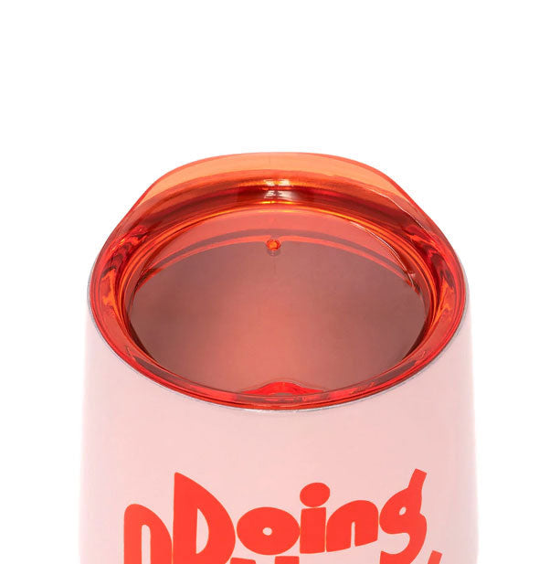 Closeup of Doing Nothing Stainless Steel Wine Glass clear red plastic lid