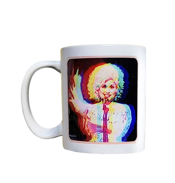 White coffee mug with distorted image of Dolly Parton appearing to raise her middle finger