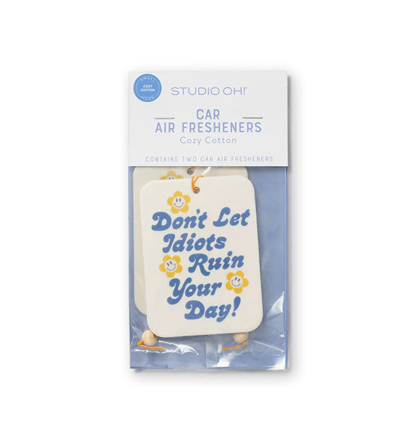 Pack of two car air fresheners that say, "Don't let idiots ruin your day!" in blue retro script with yellow flower smiley face accents