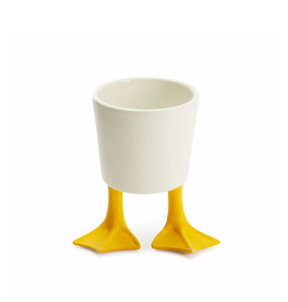 White planter pot with yellow webbed duck's feet supports