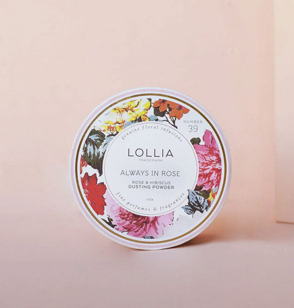 Round floral-patterned container of Lollia Always In Rose Dusting Powder