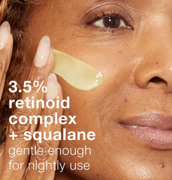 Model applies a streak of Dermalogica Dynamic Skin Retinol Serum to cheek; image is captioned, "3.5% retinoid complex + squalane: gentle enough for nightly use"