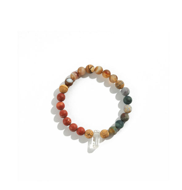 Crystal bad bracelet with red, orange, brown, and green color scheme around a clear crystal point