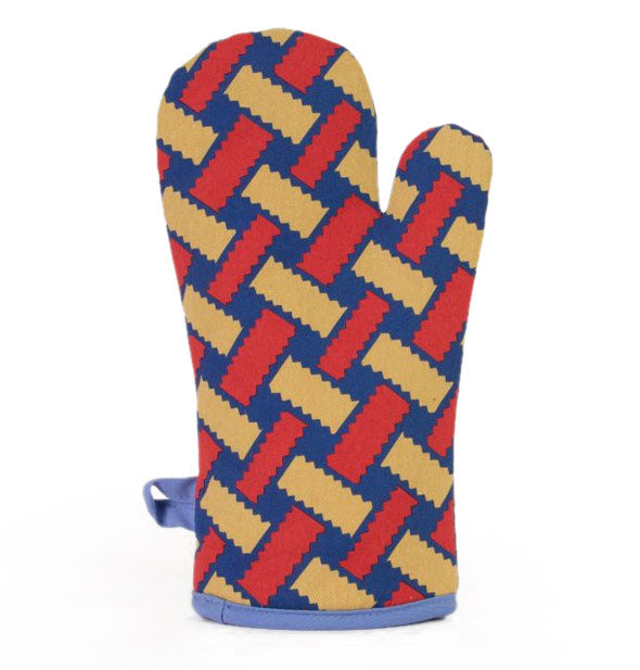 Dark blue oven mitt with blue piping and hanging loop features a lattice design in gold and red
