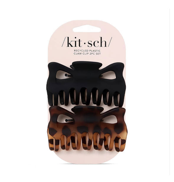 One large matte black and one large matte brown tortoise claw clip attached to a light pink Kitsch product card