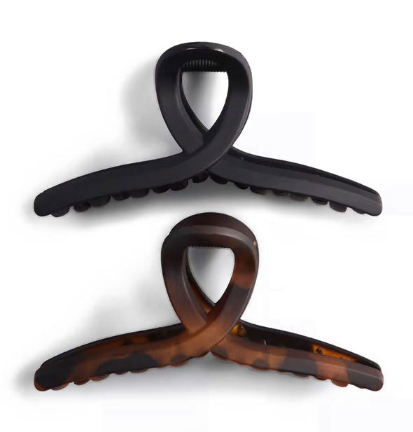 Two loop shape claw clips, one black and one brown tortoise