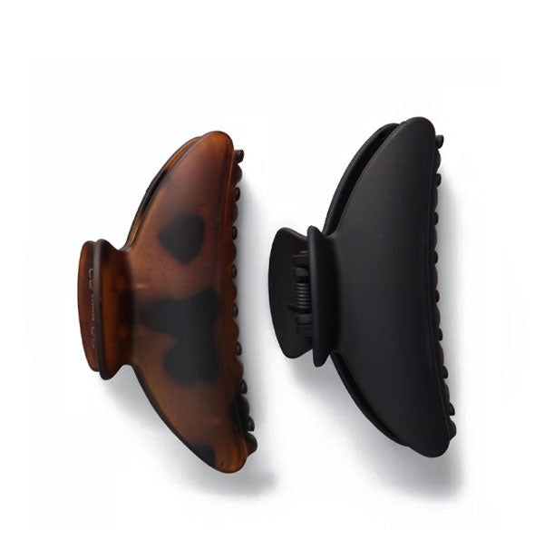 One matte brown tortoise and one matte black medium-sized claw clip