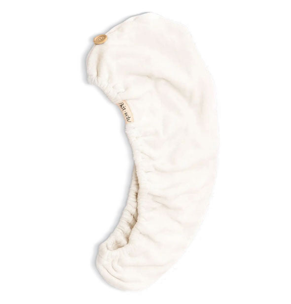 Eco-Friendly White microfiber hair towel wrap by Kitsch lays flat to show button closure and elastic opening