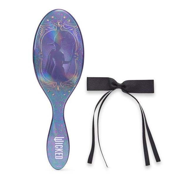 Holographic purple Wicked Wet Brush paddle featuring Elphaba's silhouette and a black hair bow to the right