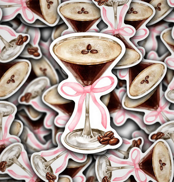 Smattering of stickers depicting an espresso martini garnished with coffee beans and tied with a pink bow around the glass stem