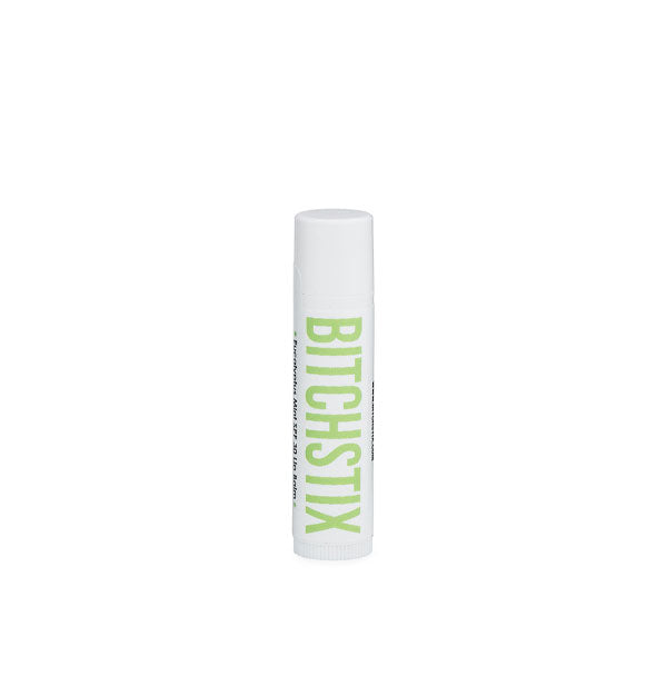 White tube of Bitchstix lip balm with green lettering