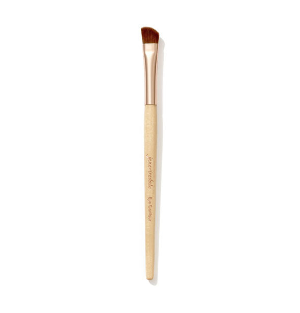Jane Iredale Eye Contour Brush with wooden handle, gold ferrule, and short, sloped bristle head