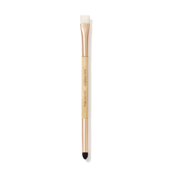 Double-ended Jane Iredale Eye Liner/Brow Brush with wooden handle, gold ferrules, and short, white, flat bristles at the top and a pointed black sponge blender at the bottom
