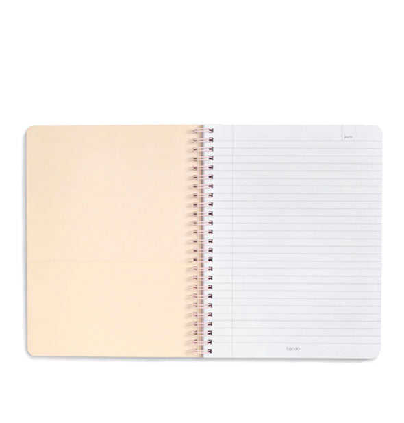 Open notebook with spiral-bound lined and cream-colored pocket pages