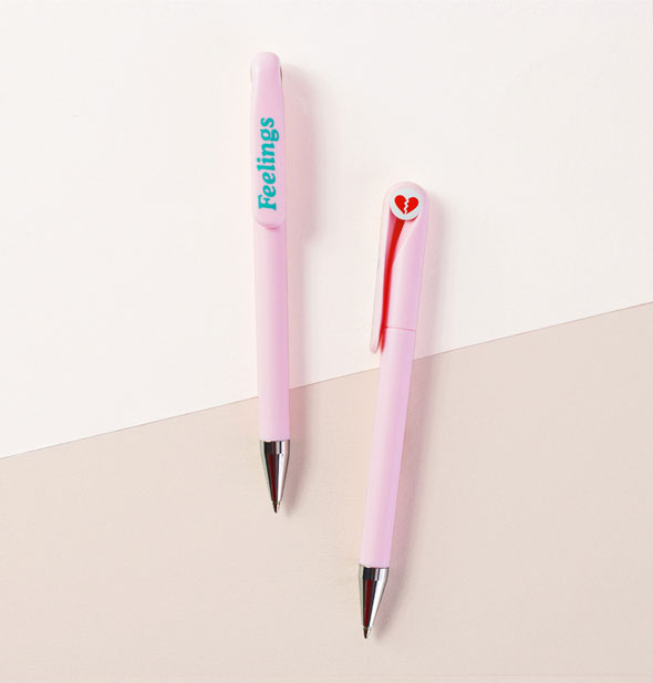 Pink pens feature a red broken heart graphic on top and the word, "Feelings" in blue on the clip