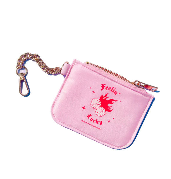 Light pink coin purse with zipper and gold chain attached says, "Feelin' Lucky" in red gothic lettering and features a pair of flaming dice in the center