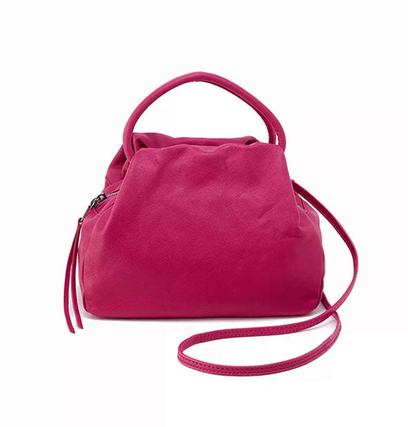 Dark pink leather satchel bag with top handles and a longer handle extended partially at right