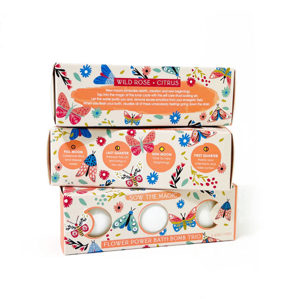 Sow the Magic Flower Power Bath Bomb Trio box shown from different angles with moon phase and scent descriptions, all featuring floral and butterfly designs
