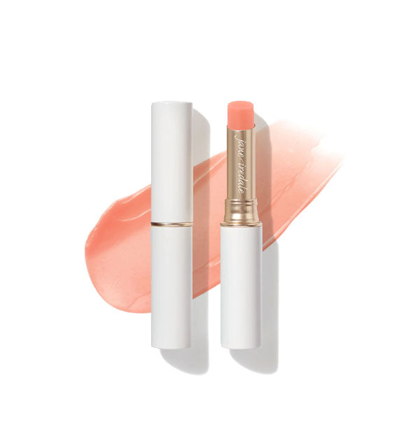 White and gold tubes of Jane Iredale Just Kissed Lip and Cheek Stain, one with cap removed to reveal the tip, and a sample product application behind both in the shade Forever Pink