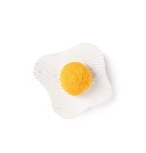Socks formed and folded to resemble a fried egg
