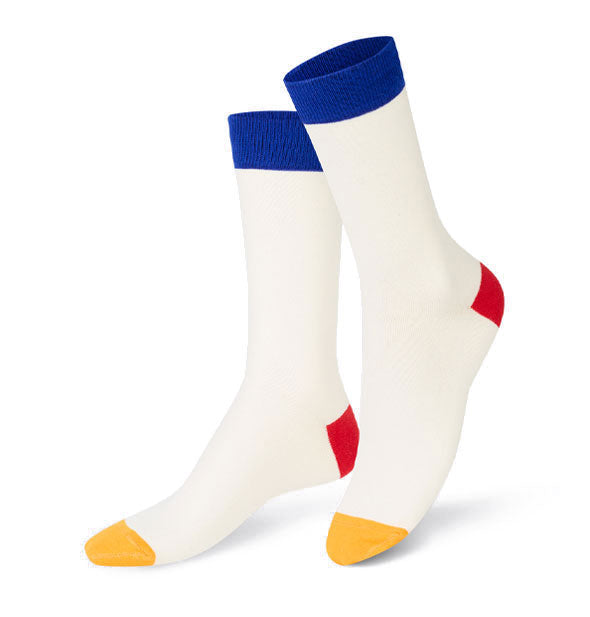 Pair of white crew socks with yellow toes, red heels, and blue top bands