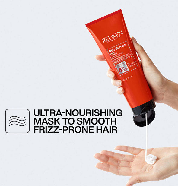 Model dispenses Redken Frizz Dismiss Mask into palm of hand next to the caption, "Ultra-nourishing mask to smooth frizz-prone hair" with infographic