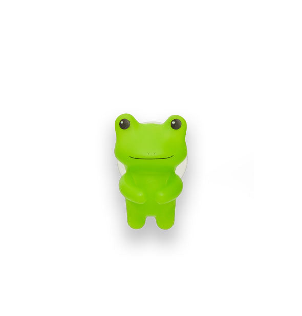 Green frog figurine with partially-visible suction cup backing