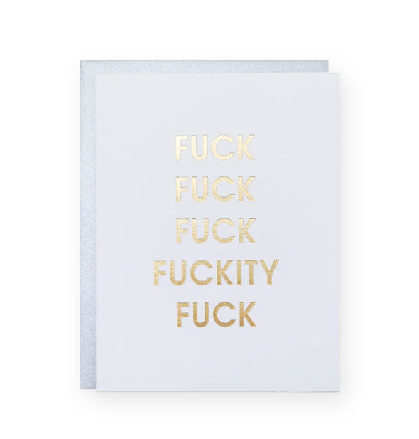 White greeting card on top of a partially-visible silver envelope says, "Fuck fuck fuck fuckity fuck" in metallic gold foil lettering