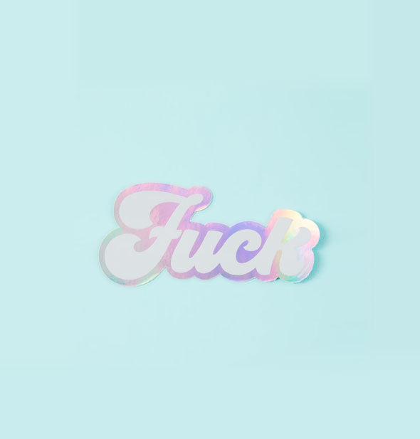 Holographic sticker with lettering that says, "Fuck" on a light teal background