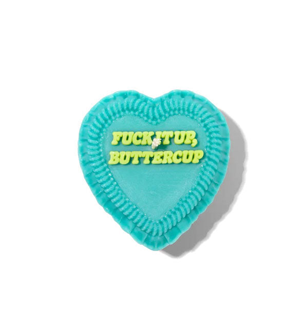 Teal heart-shaped candle is designed to resemble a decoratively frosted cake that says, "Fuck it up, buttercup" in lime green italic lettering on top