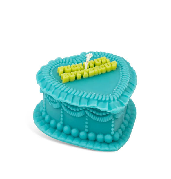 Teal heart-shaped candle is designed to resemble a decoratively frosted cake that says, "Fuck it up, buttercup" in lime green italic lettering on top