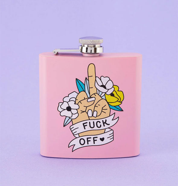 Light pink square flask features a middle finger illustration flanked by flowers and wrapped in a banner that says, "Fuck off" with a heart graphic