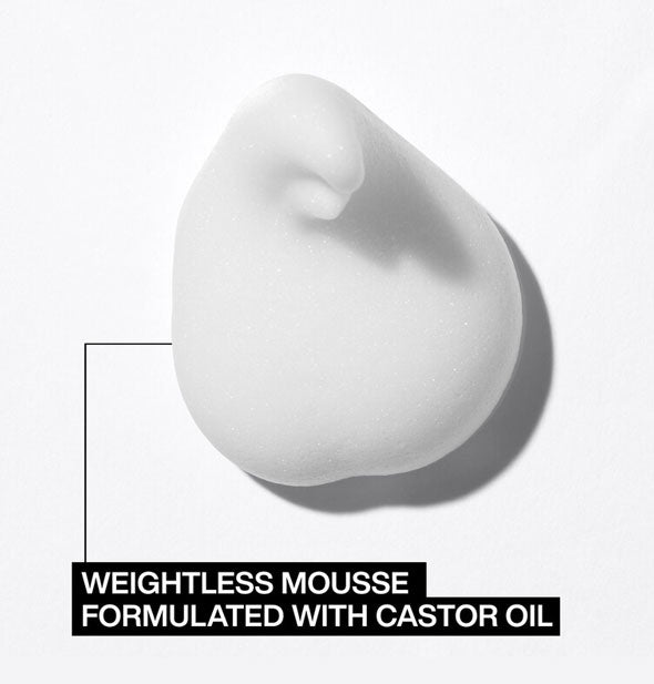 White dollop of Redken Full Volume Mousse is labeled, "Weightless mousse formulated with castor oil"