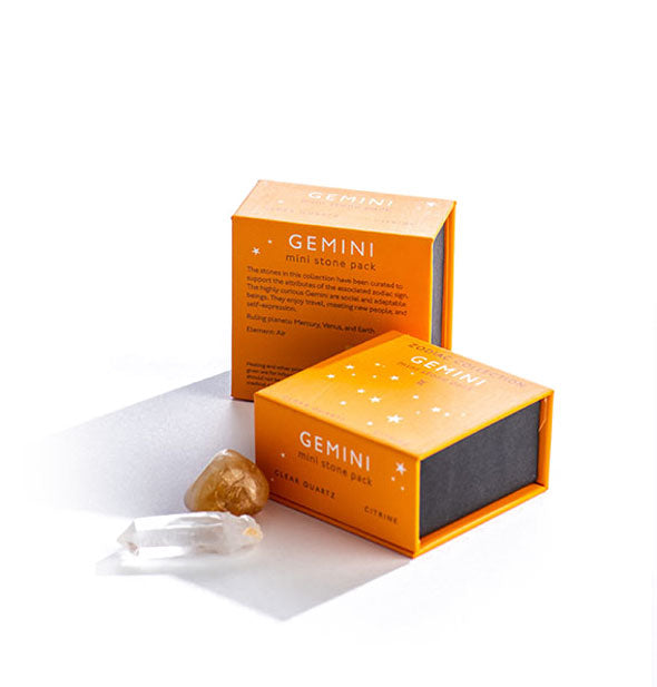 Two orange Gemini Mini Stone Packs with crystals displayed in front