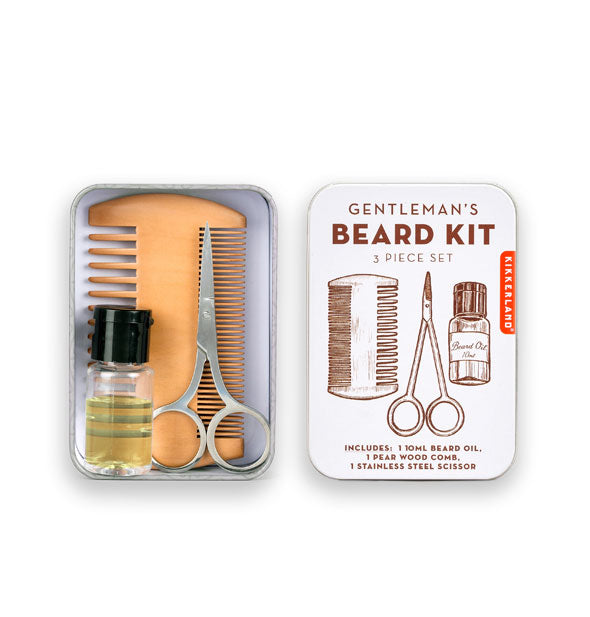 Rectangular white Gentleman's Beard Kit with lid removed to reveal double-sided wooden comb, stainless steel scissors, and beard oil vial inside