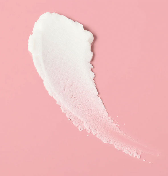 Sample smear of Verb Ghost Air Dry Whip on a pink surface is white and slightly gritty in texture