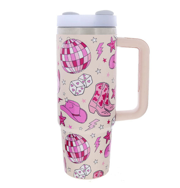 Light pinkish-beige drink tumbler with large squared handle features all-over print of pink cowgirl boots, heart-pipped dice, pink disco balls, lightning bolts, and stars