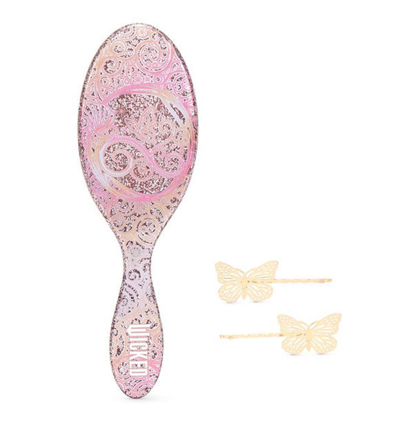 Ornately swirled pink Wicket Wet Brush Paddle with two gold butterfly bobby pins