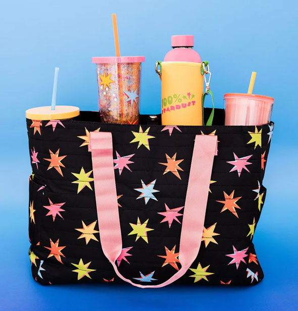 Starburst bag holds four drink tumblers against a blue backdrop