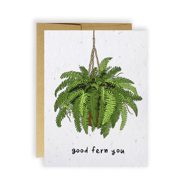 White greeting card backed by a kraft envelope features illustration of a hanging green fern plant and the message, "Good fern you" in black handwritten lettering